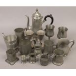 A collection of pewter wares coffee pot, tankards and goblets.