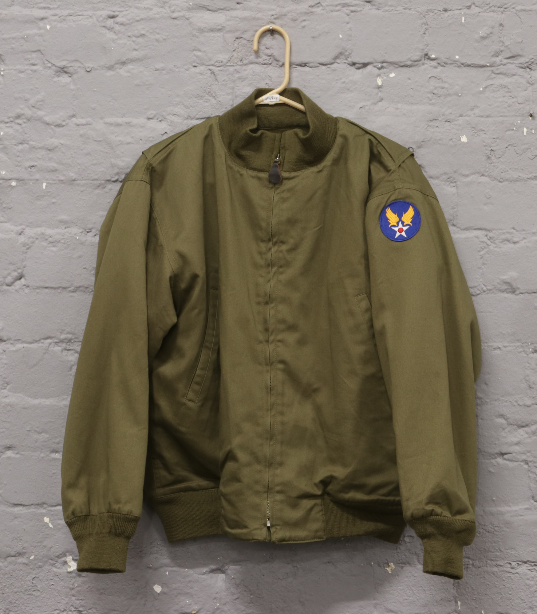 A post war winter combat jacket with American Airforce shoulder badge for enthusiasts, re-enactors