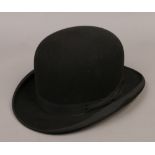 A black felt bowler hat by the atlas brand.
