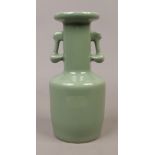 A Chinese celadon twin handle vase.