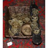 A basket of horse brasses to include trench art ash tray.