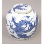 A large Chinese blue and white lidded jar decorated with a dragon, 27cm high.Condition report