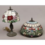 A Tiffany style table lamp with leaded stain glass shade, decorated with dragonflies along with