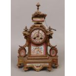 A 19th century French gilt metal eight day mantel clock striking half hourly on a bell and with pink