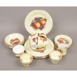 A six part bone china tea service decorated with fruit.