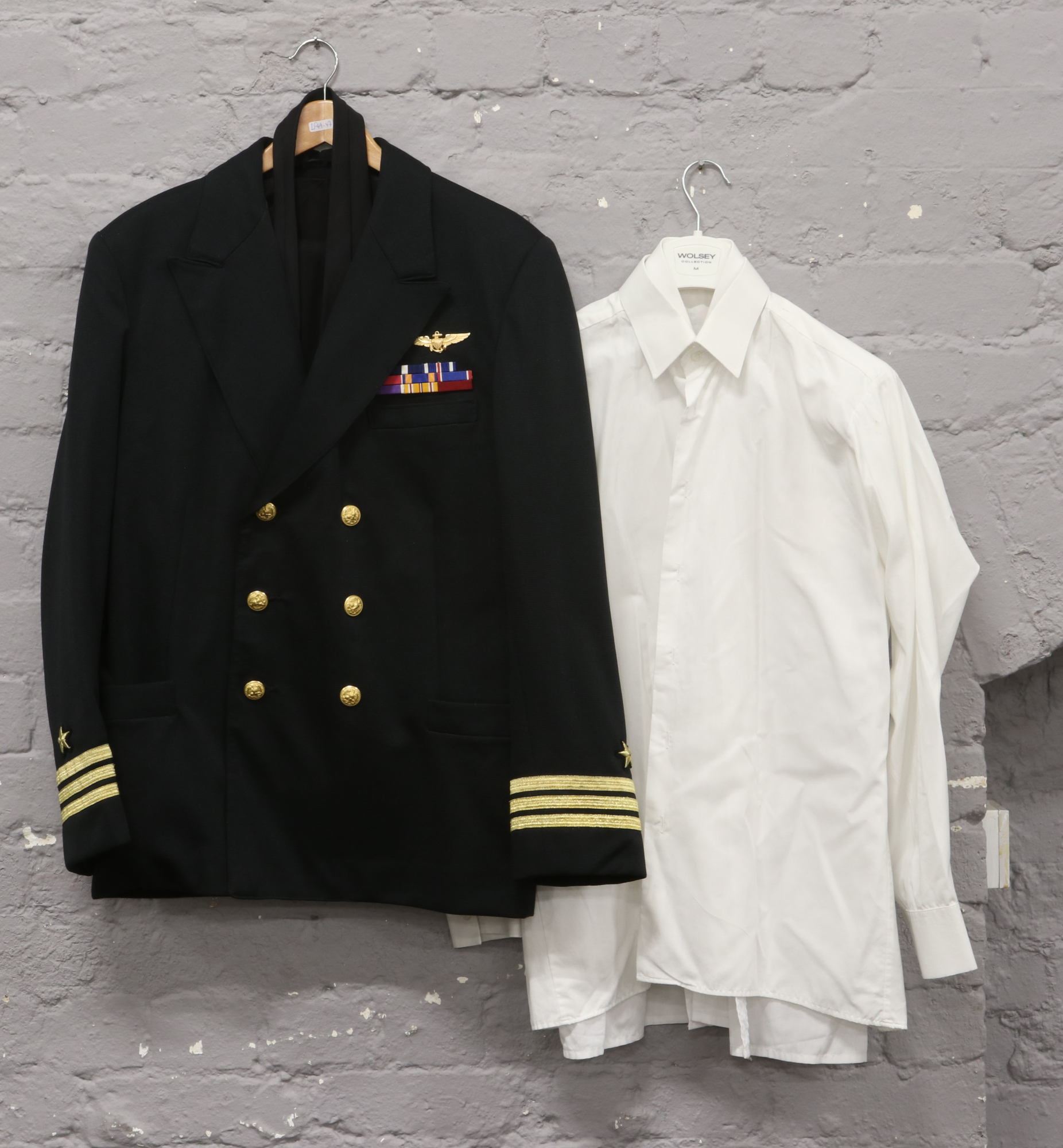 A genuine post World War II US Navy 'dress blue' uniform and accessories commander rand three band