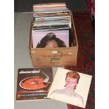 A box of LP records to include David Bowie, Eagles, Status Quo etc.