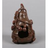 A 19th century Chinese carved bamboo brush washer. Formed as a gourd and with a fruit bat to the