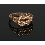 A 9 carat gold knot ring. 5.8 grams, size L.