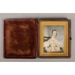 A Victorian ivory portrait miniature in leather mounted case and with gilt bronze frame. Portrait of