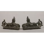 A pair of Victorian cast bronze furniture mounts formed as a pair of recumbent sphinx, 23cm long.