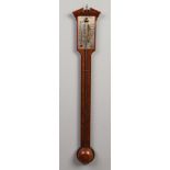 A 20th century Georgian style mahogany stick barometer with silvered dial and adjuster. Having