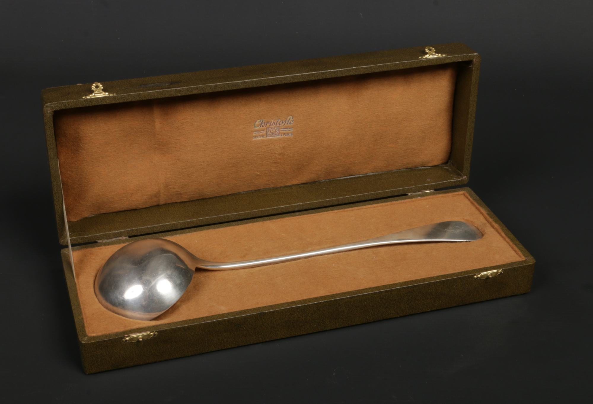 A boxed French silver soup ladle by Christofle. With engraved cipher to the terminal, Minerva