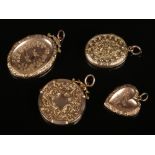 Four Victorian gold fronted lockets with engraved decoration. Three marked 9ct Back and Front.