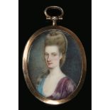 An English portrait miniature of a lady in yellow metal pendant mount c.1680-1730, 36mm x 29mm.