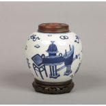 A 19th century Chinese blue and white ginger jar with associated hardwood cover and stand. Painted