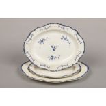 An 18th century pearlware serving platter, with feather moulded rim and painted in underglaze blue