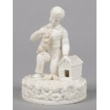 An early 19th century Derby biscuit figure. Formed as a young boy by a rabbit hutch with three