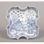 An early 19th century pearlware blue and white shaped supper dish. Printed in underglaze blue with a