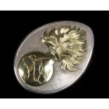 A silver and 18 carat gold mounted Grenadier Guards sweetheart brooch of tear form. Set with the