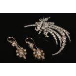 An antique white metal and rose cut diamond spray brooch and similar pair of lozenge shaped earrings