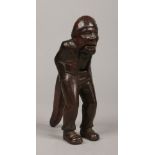 A 19th century carved Swiss nut cracker. Formed as a standing man wearing a nightcap and with his