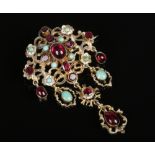 A 19th century Austro Hungarian enamelled silver gilt drop brooch set with faceted and cabochon