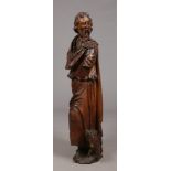 A 19th century Continental carved walnut sculpture of Saint John the Baptist dressed in flowing