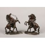 After Guillaume Coustou the Elder (French 1677-1746) a good pair of small patinated bronze Marley