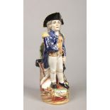 A Victorian Staffordshire pottery character jug formed as Admiral Lord Nelson and raised on a