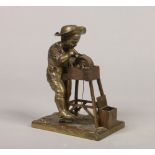 An early 20th century French gilt bronze figural and mechanical vesta. Formed as a boy working a