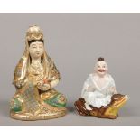 A 20th century Japanese Satsuma figural lamp base formed as Guanyin seated holding a scroll along