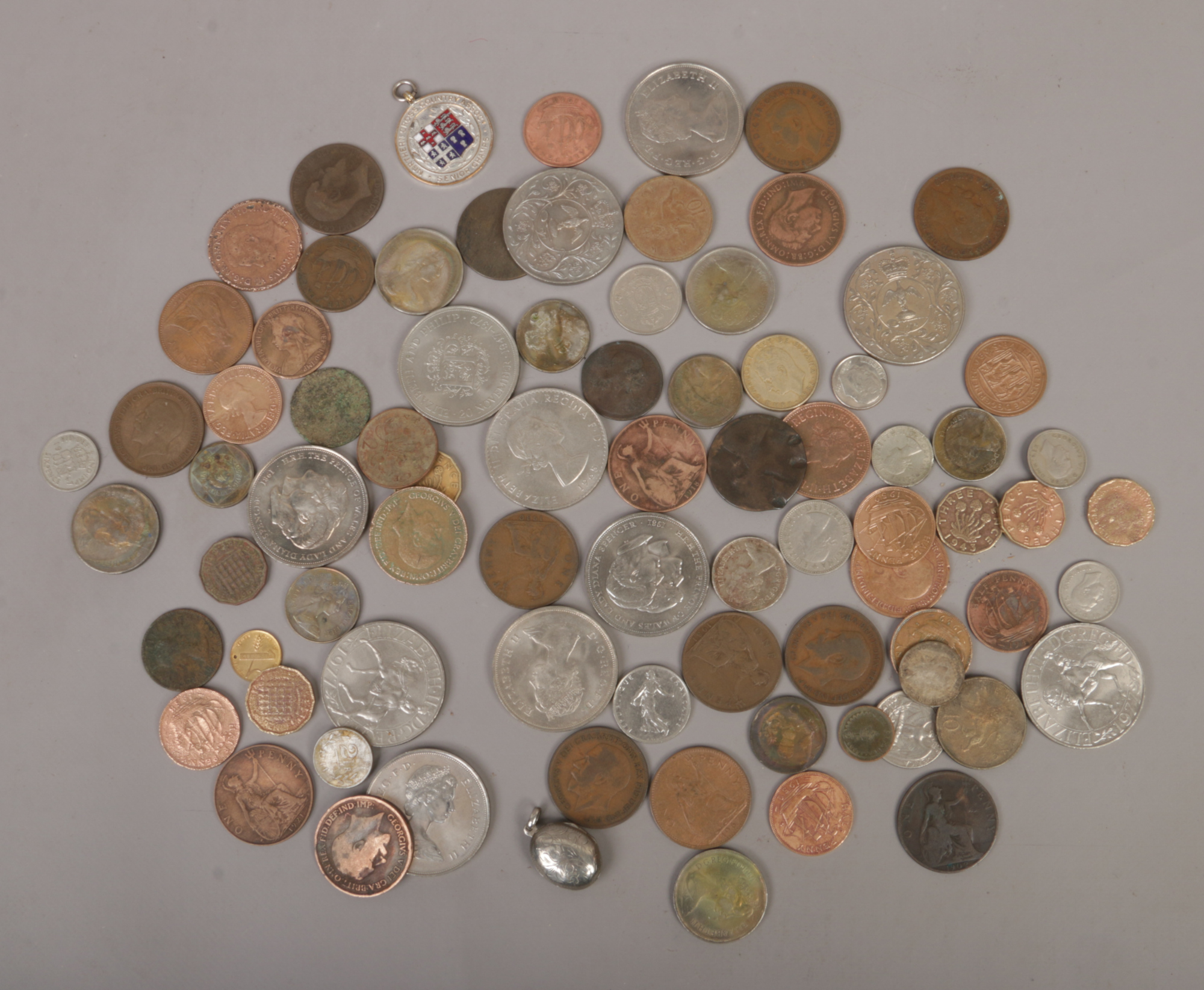 A box of mostly British pre decimal coins to include one penny, shillings, three pence coins etc.