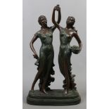 A bronzed composite mystery clock base formed as two classical maidens.