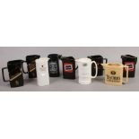 A collection of nine advertising water jugs to include Teachers, Black Lable, Johnie Wackel and John