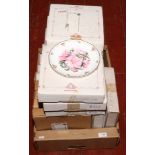 Fourteen boxed cabinet plates and stands including Royal Albert.