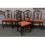 Five Edwardian mahogany dining chairs in the Hepplewhite style with red upholstered seats