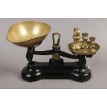 A set of vintage cast iron and brass weighing scales by Libra Scale Company, along with a quantity