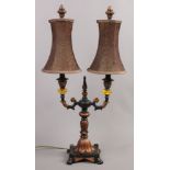 A French Empire style twin branch tablelamp with ebonized and bronzed base.