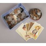 A box of mixed coins including British pre-decimal and a small collection of vintage Swiss