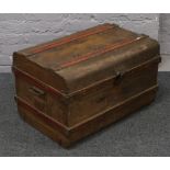 A painted tin travel trunk.