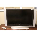 A LG flatscreen television model number RZ - 37LZ55APUKLF with power lead and remote control.