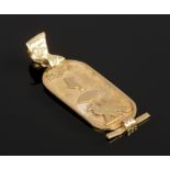 An Egyptian gold cartouche pendant cast with hieroglyphics and with a bale formed as a Pharaoh, 2.