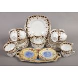 A Royal Vale tea service with swags and gilt decoration 39 pieces, along with a Royal Winton