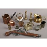 A group of decorative metalwares including a pair of miniature brass candlesticks, ornamental