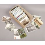 A box of colour and monochrome postcards, approximately 400.