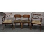 A pair of Beautility dining chairs, along with a pair of mahogany sabre leg carver dining chairs.