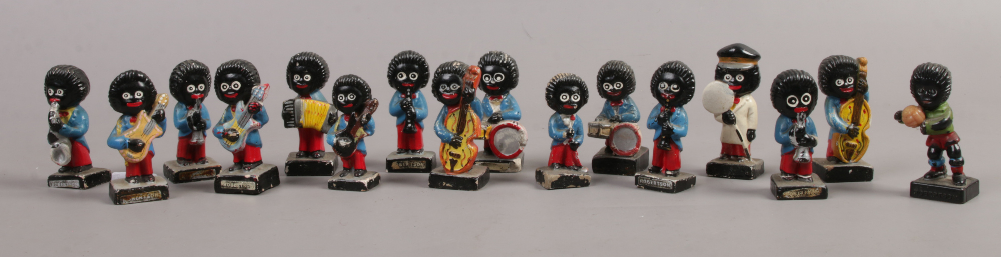 A quantity of vintage Robertson advertising figures including musicians, lolly pop man etc, 16 in