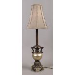 A bronzed effect ornate table lamp height 72cm.