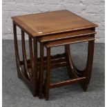 A nest of three G plan style teak tables.